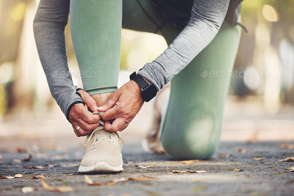 Elderly runner, hands and shoes for running, fitness in the park with exercise and start to run wit