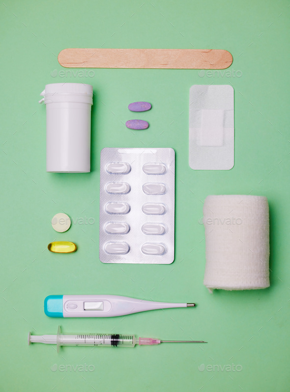 What do you need for your first-aid kit. Shot of medical equipment against a green background.