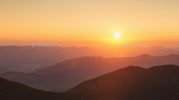 Beautiful panoramic mountain landscape on golden sunset - Stock Photo - Images