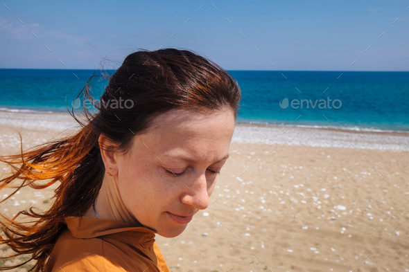 Alone woman feel freedom and enjoying the nature near the sea - Stock Photo - Images