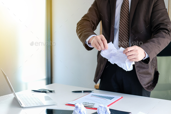 Businessman tearing contract in office. End of contract.