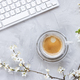 Computer keyboard on spring background with white cherry blossom flowers and espresso coffee - PhotoDune Item for Sale