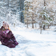 a young girl in a snow-covered forest in winter - PhotoDune Item for Sale