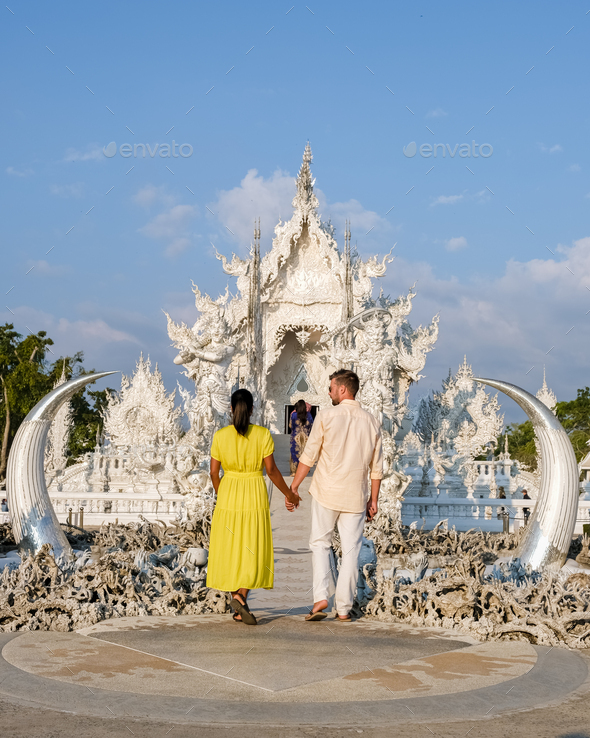 Couple visit the White temple Chiang Rai Thailand, Wat Rong Khun, Chiang Rai, Thailand. - Stock Photo - Images