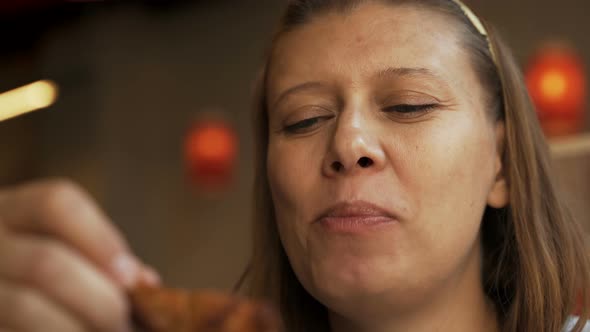 Woman In Fast Food Cafe Eating Junk Food alt