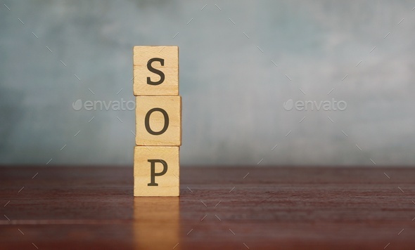Stack wooden cube with text SOP or standard operating procedure. - Stock Photo - Images