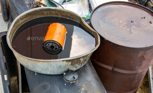 Motor in a canister of oil outdoors