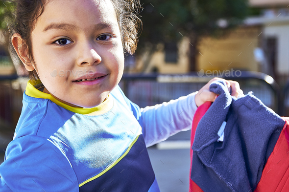latin girl football player in a elementary children soccer match - Stock Photo - Images