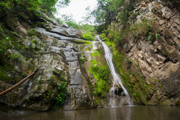 Salto del Mico waterfall surrounded by rocks in Villeta, Colombi Stock ...