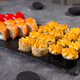 Sushi set. Philadelphia roll, california, unagi with fresh ingredients on black background. Sushi - PhotoDune Item for Sale