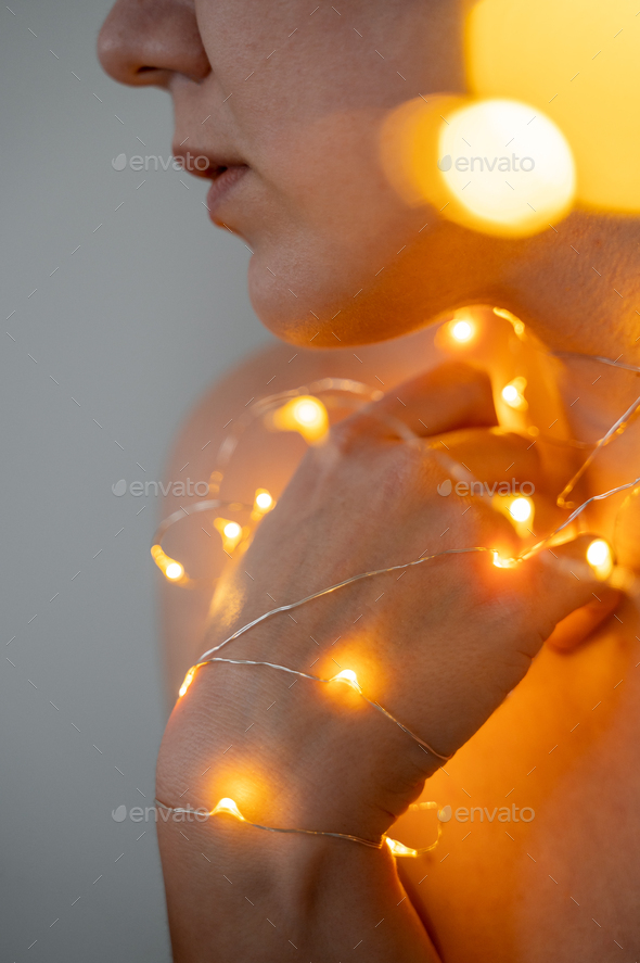 Woman neck and chin close up with lights - Stock Photo - Images