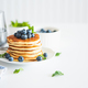 Homemade baked ricotta pancakes with fresh berries on white wooden table - PhotoDune Item for Sale