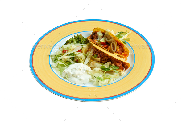 Tacos on plate with salad and avocado - Stock Photo - Images