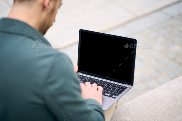 Programmer using laptop computer working freelance project, coding ...