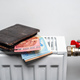 wallet with euro banknotes on central heating radiator, concept of expensive heating costs, closeup - PhotoDune Item for Sale