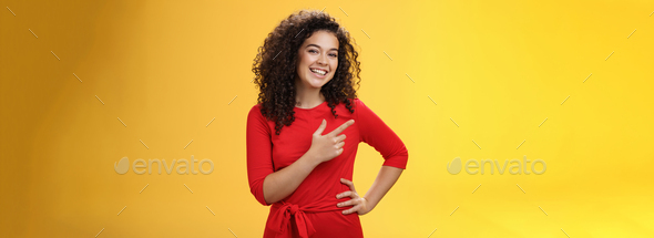 Portrait of friendly and assertive charming female coworker showing around newbie pointing left and