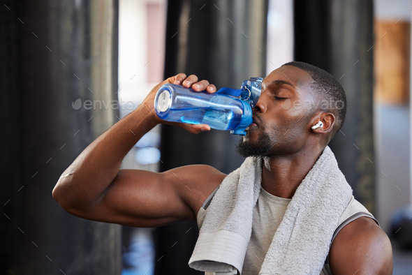 Premium Photo  Black man drink water fitness and gym with challenge workout  training for muscle and thirsty with motivation goals and sweating tired  sports athlete person with water bottle in health