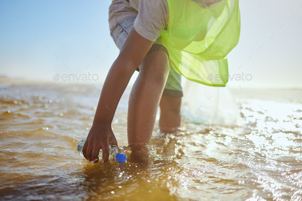 Plastic bottle, cleaning ocean and kid with environment and climate change, environmental and volun