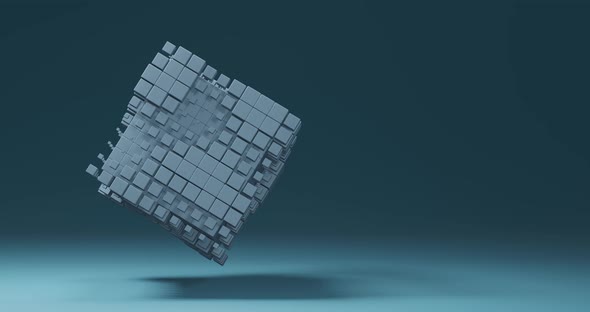 Small boxes floating around a spinning white cube. Minimalist abstract background with copy space alt