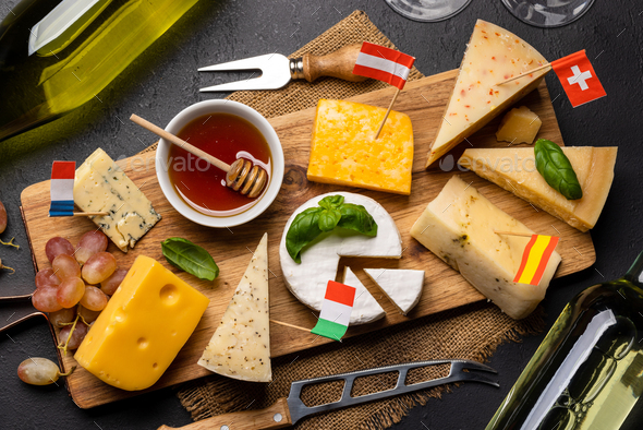 Various cheese on board and white wine