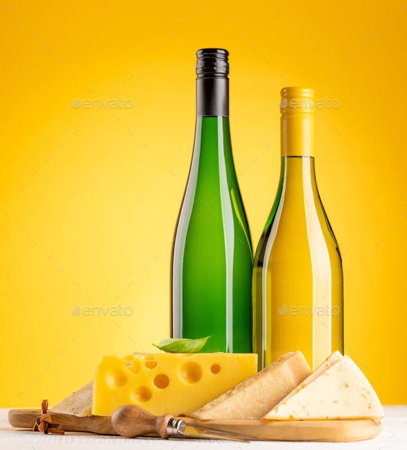 Various cheese on board and white wine - Stock Photo - Images