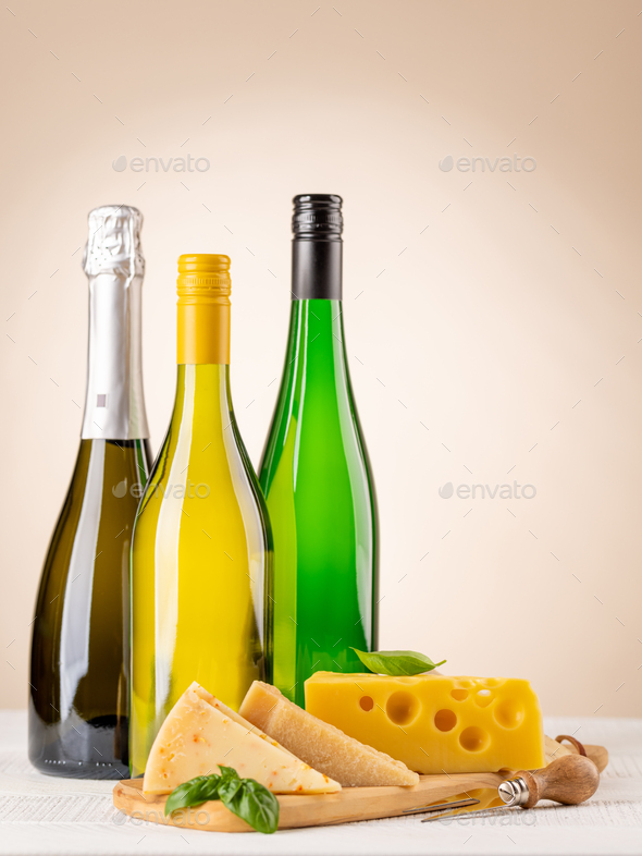 Various cheese on board and white wine - Stock Photo - Images