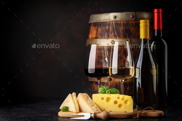 Various cheese on board, red and white wine - Stock Photo - Images