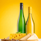 Various cheese on board and white wine - PhotoDune Item for Sale