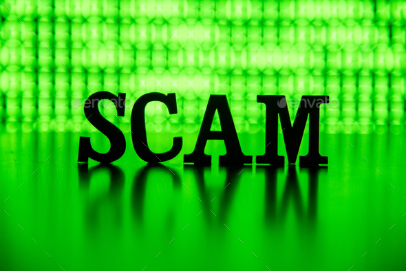 SCAM spelled out backlit by green - Stock Photo - Images