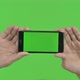 Holding Smartphone Horizontal Green Chroma Key - VideoHive Item for Sale