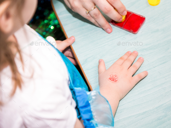 Temporary tattoo on a kid\'s hand