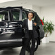 Portrait of black female driver standing near a car - PhotoDune Item for Sale