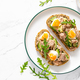 Tuna toast. Open sandwiches with whole grain bread, canned tuna, boiled egg, avocado and arugula - PhotoDune Item for Sale