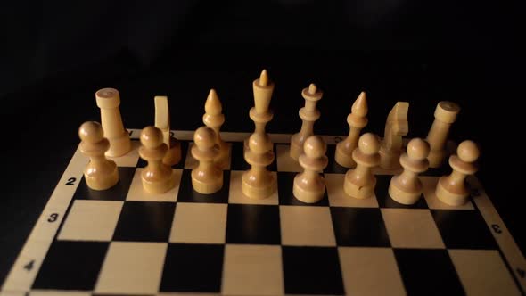White Wooden Pieces on a Chessboard alt