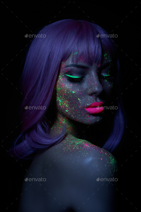 Fashion model woman neon light bright fluorescent makeup, long hair, drop  on face. Beautiful model Stock Photo by IvaFoto