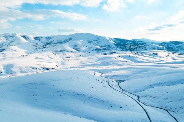 Aerial shot of beautiful snow capped mountains and hills winter landscape of Zlatibor - Stock Photo - Images