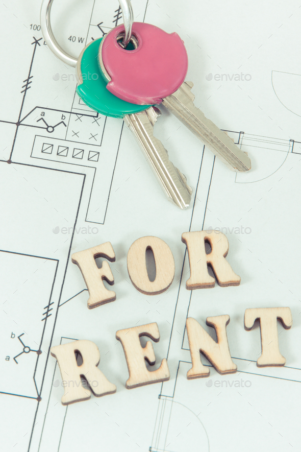Inscription for rent and home keys on electrical construction housing plan - Stock Photo - Images