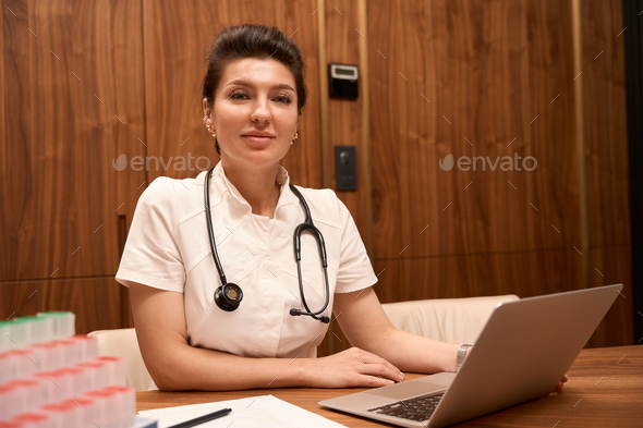 Doctor working in the hospital, online consultation - Stock Photo - Images