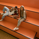 Happy students are sitting on steps together - PhotoDune Item for Sale