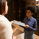 Pretty African American female taking documents at reception - PhotoDune Item for Sale