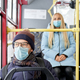Passengers protecting themselves by mask in bus - PhotoDune Item for Sale