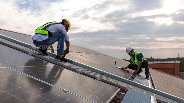 Engineer working setup Solar panel at the roof top. Stock Photo by kckate16