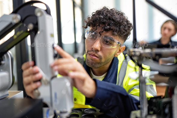 Engineer learn basic theory how to operation maintenance and programing robot arm in training room - Stock Photo - Images