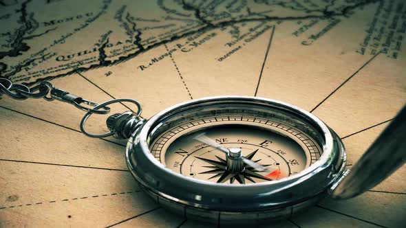 Antique Compass on Vintage World Map