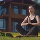 Young Woman Practicing Yoga on Plot of Country House - VideoHive Item for Sale