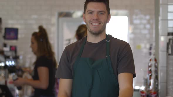 Portrait of man working at coffee shop