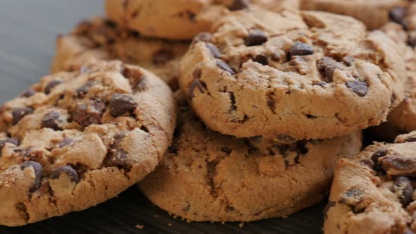 Chocolate chip cake cookies on the wooden table slow panning 4K 2160p UltraHD footage -Arranged on w alt
