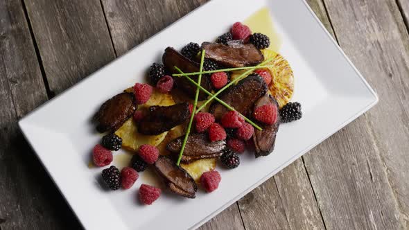 Rotating - smoked duck bacon with grilled pineapple, raspberries, blackberries and honey alt