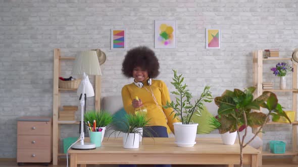 Expressive Dancing Positive Beautiful African American Woman with an Afro Hairstyle Takes Care of alt