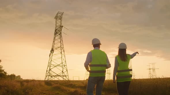 Back Two the Engineer and the Controller with a Tablet PC and the Drawings are About Lines and alt